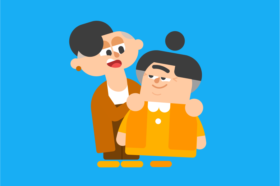 Lin standing behind Lucy with her hands on Lucy's shoulders. They are looking towards each other affectionately