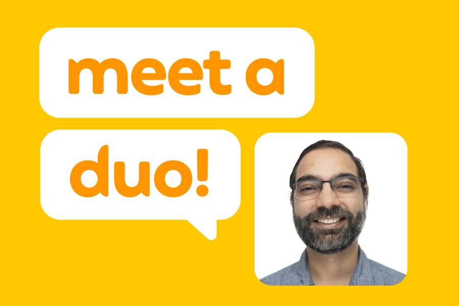Illustration of a smiling man, next to speech bubbles reading "Meet a Duo!"