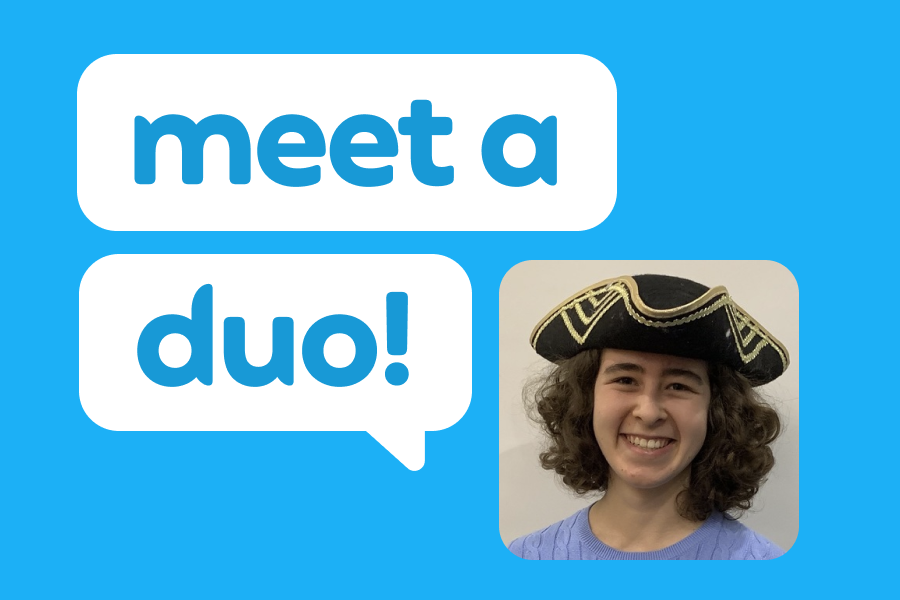 Illustration of a smiling woman wearing a tricorn hat, next to two speech bubbles reading "Meet a Duo!"