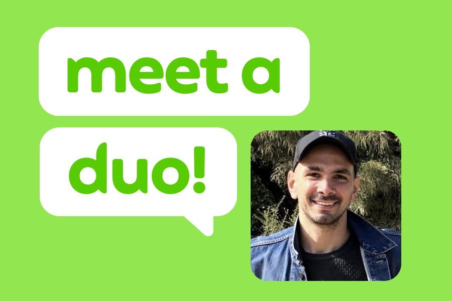 Illustration of a smiling man wearing a baseball cap, next to speech bubbles that read "Meet a Duo!"