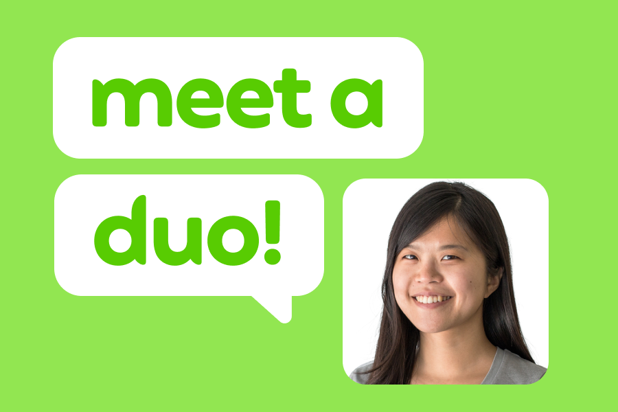 Illustration of a smiling woman wearing a gray shirt, next to speech bubbles that read “Meet a Duo!”