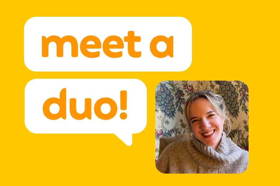 Illustration of a smiling woman in a tan turtleneck sweater, next to speech bubbles that read “Meet a Duo!”