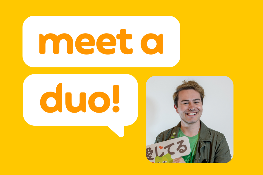 Photo of a smiling man wearing a green Duolingo shirt next to the phrase "Meet a Duo!"