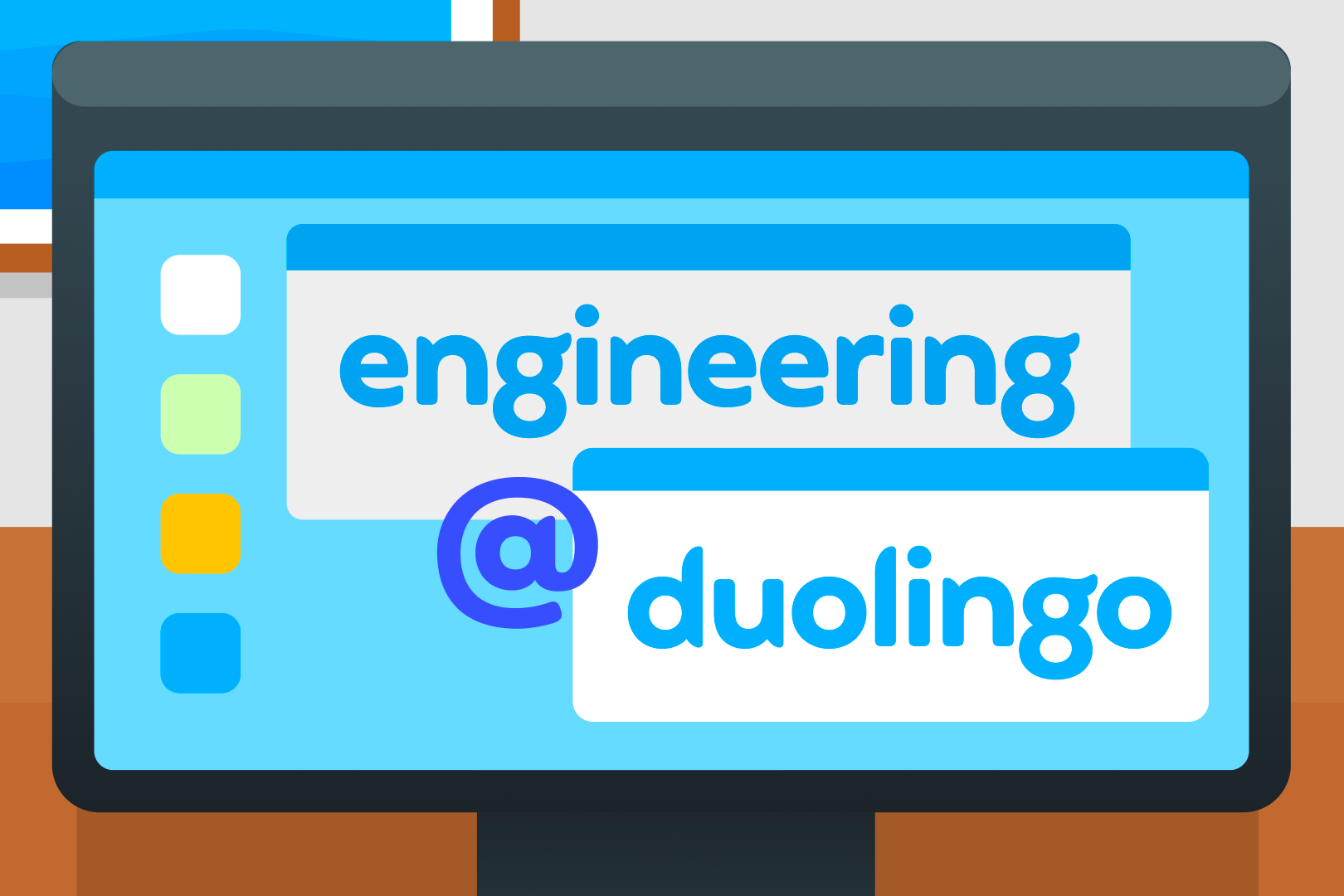 Large computer monitor that says "engineering @ duolingo" on screen