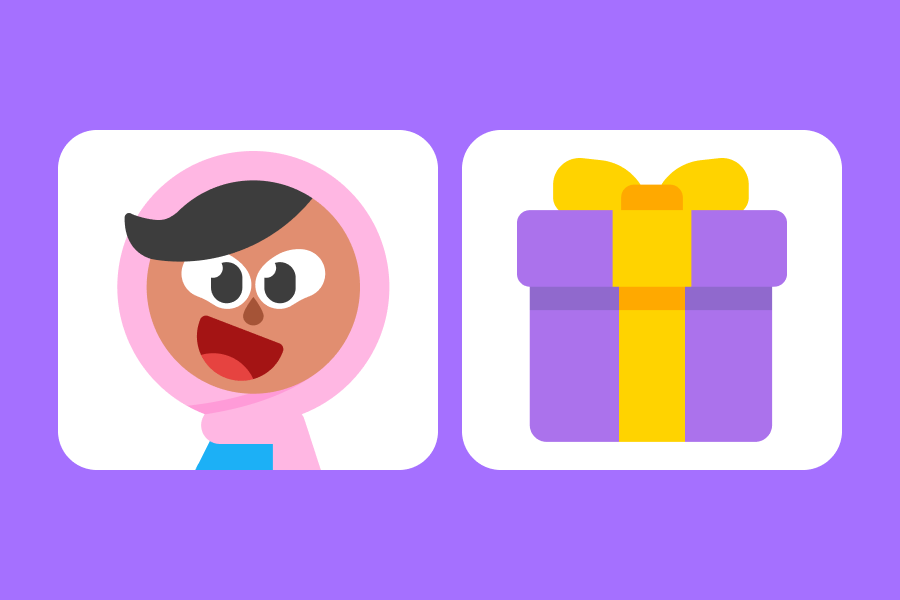  Zari looking excited next to a wrapped gift box with a big bow on top