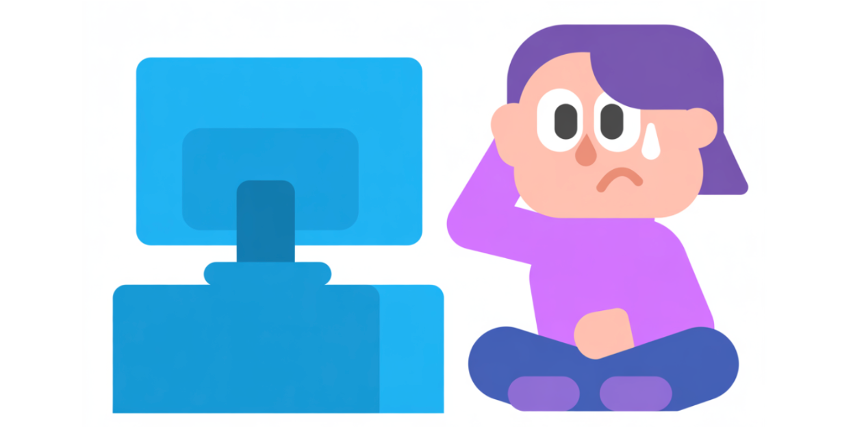 A person looking worried with a bead of sweat running down their face seated in front of a computer screen