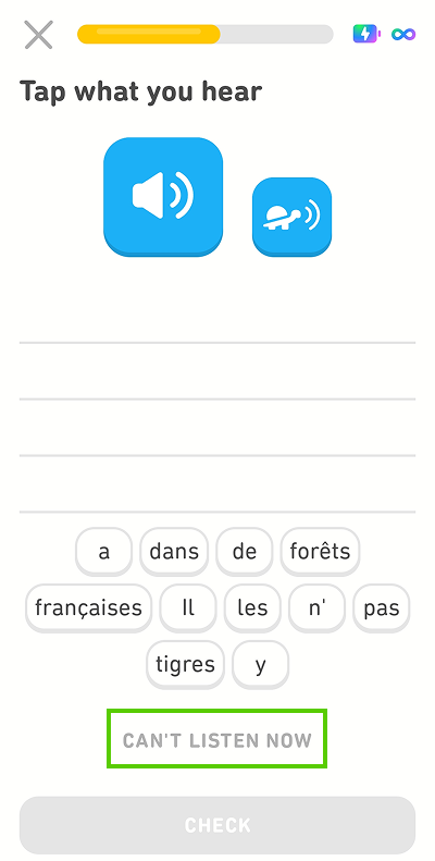 Screenshot of the app mid-lesson. The instructions given for the exercise are “Tap what you hear,” with a blank space and a word bank of French words beneath. There is a blue button with a speaker icon and a smaller blue button with an image of a turtle. Below the word bank is the option “Can’t listen now,” which is highlighted in green.