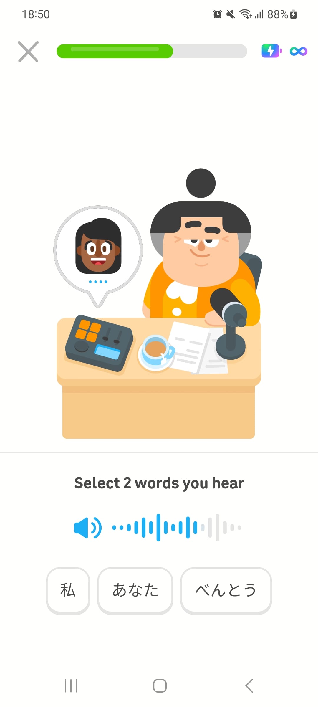 Screenshot of a DuoRadio lesson. Duolingo character Lucy is sitting at a desk while a speech bubble with a woman’s face on it floats above radio equipment, indicating a call in progress. The instructions given to the user are “Select 2 words you hear.” Underneath is a speaker icon and a progress bar, showing the audio partially in progress. The user has 3 Japanese words to select from.