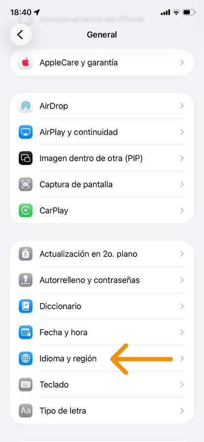 A screenshot of the “General” menu with an arrow pointing at “Idioma y región.”