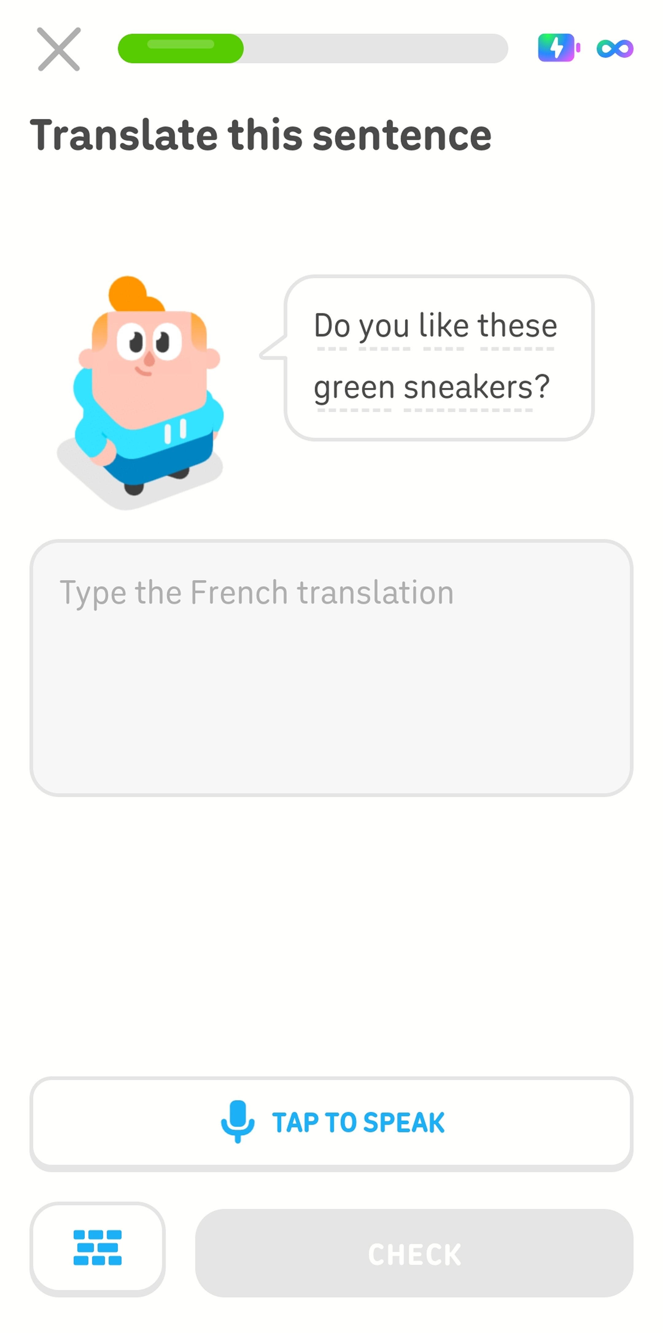 Screenshot mid-lesson. The instructions read “Translate this sentence,” and Duolingo character Junior is standing next to a speech bubble that says “Do you like these green sneakers?” in English. Below him is an empty text box with the instructions “Type the French translation.”