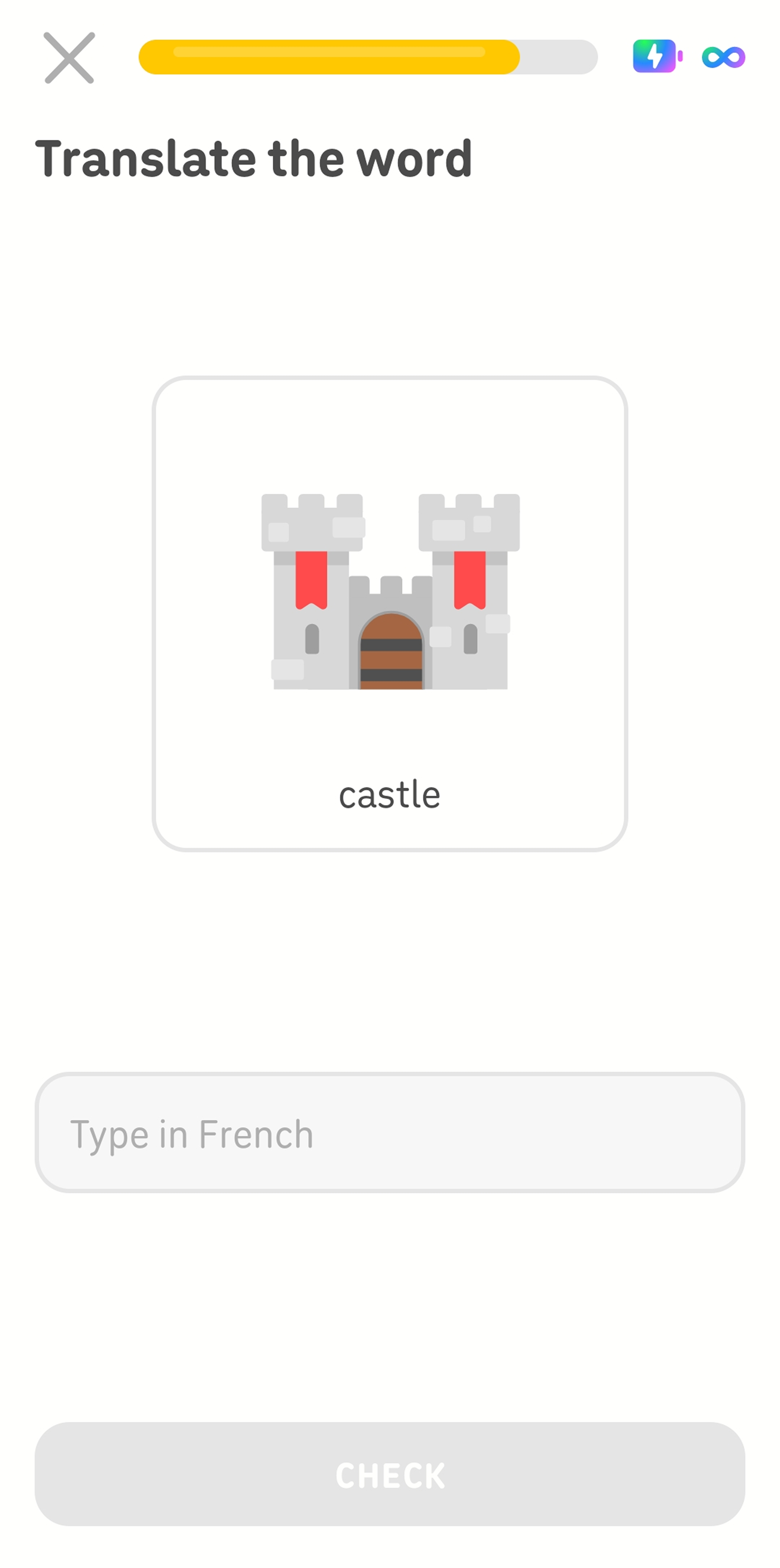 Screenshot mid-lesson. The instructions read “Translate the word,” and there is an illustration of a castle with the English word “castle” beneath it. An empty text box has the instructions “Type in French.”