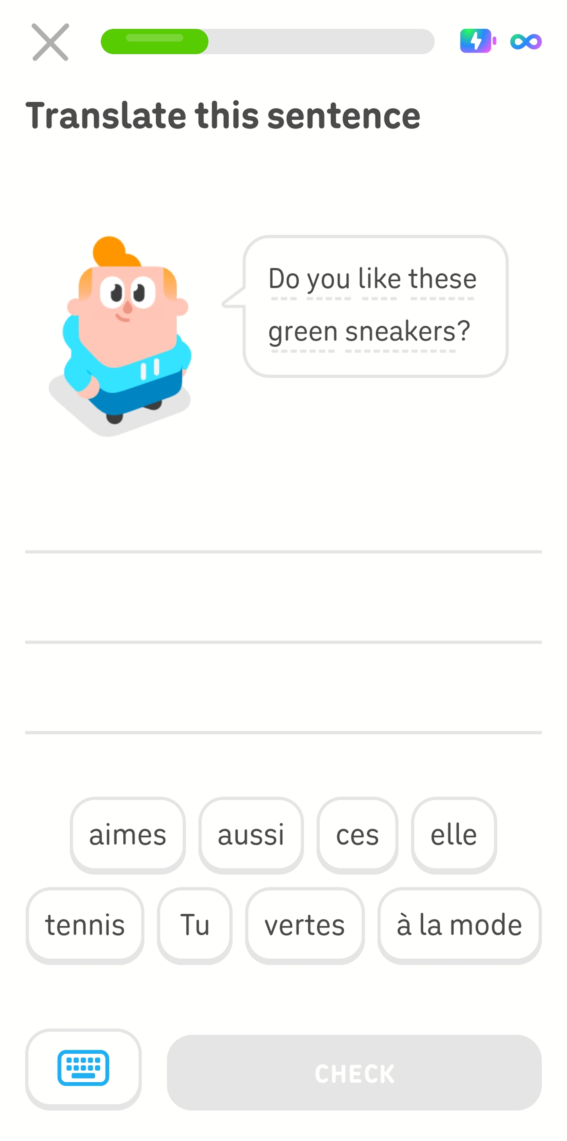 Screenshot mid-lesson. The instructions read “Translate this sentence,” and Duolingo character Junior is standing next to a speech bubble that says “Do you like these green sneakers?” in English. Below him is a word bank of eight French words.