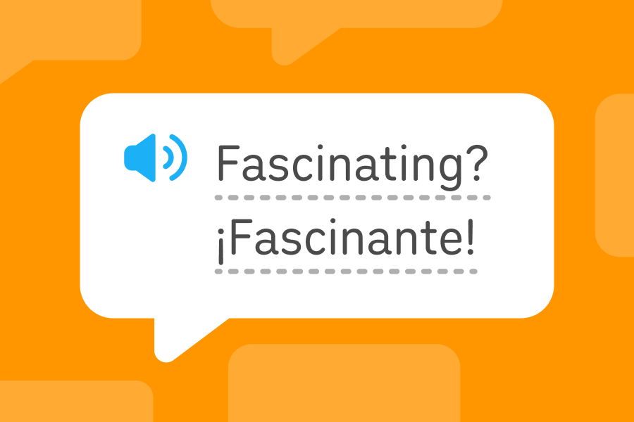 Speech bubble with the English word “fascinating” on the first row and the Spanish word “fascinante” on the second.