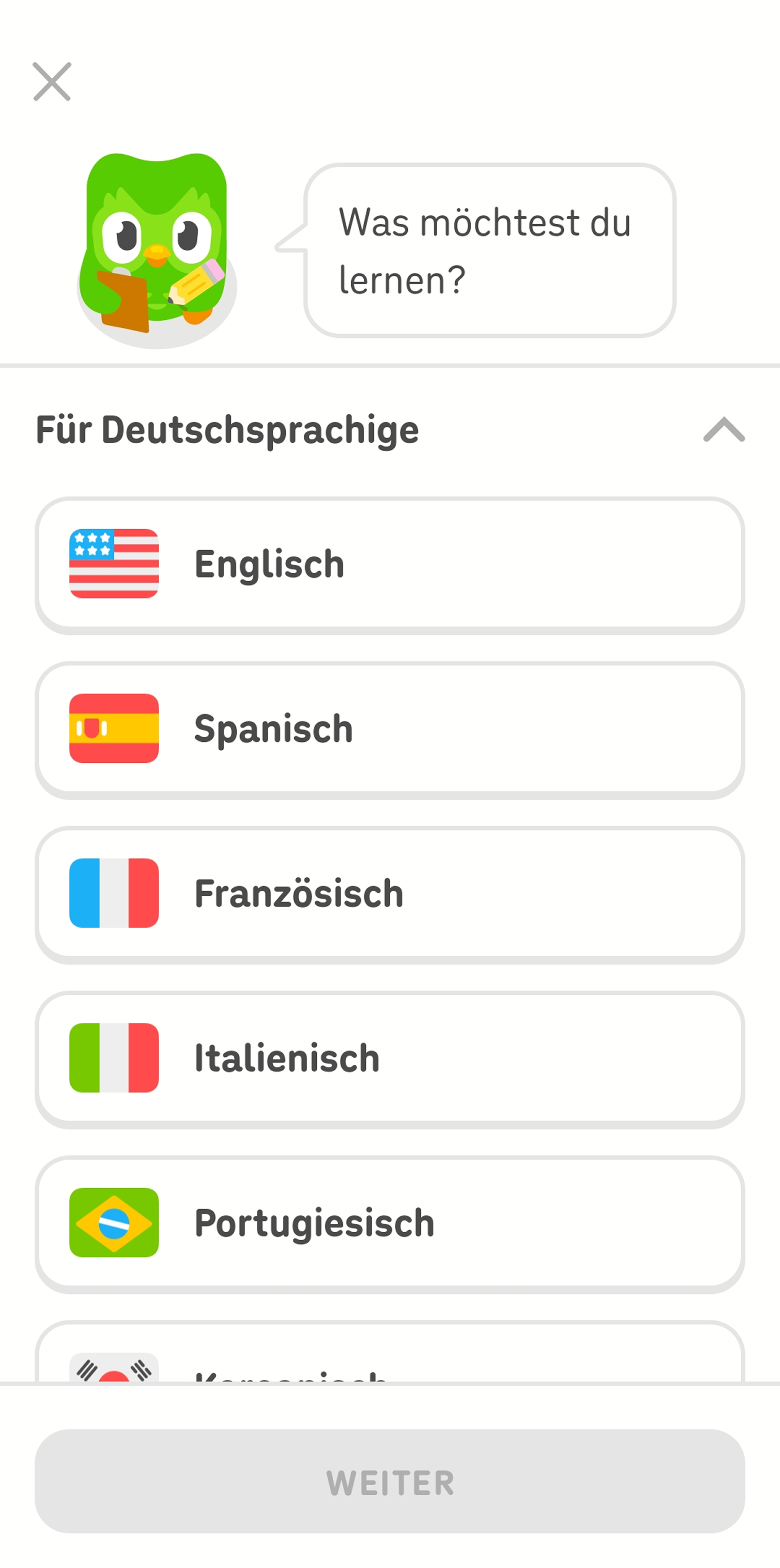 Screenshot der Duolingo-App. Die Eule Duo fragt „Was möchtest du lernen?“ und darunter werden mehrere Sprachen als Optionen aufgelistet.