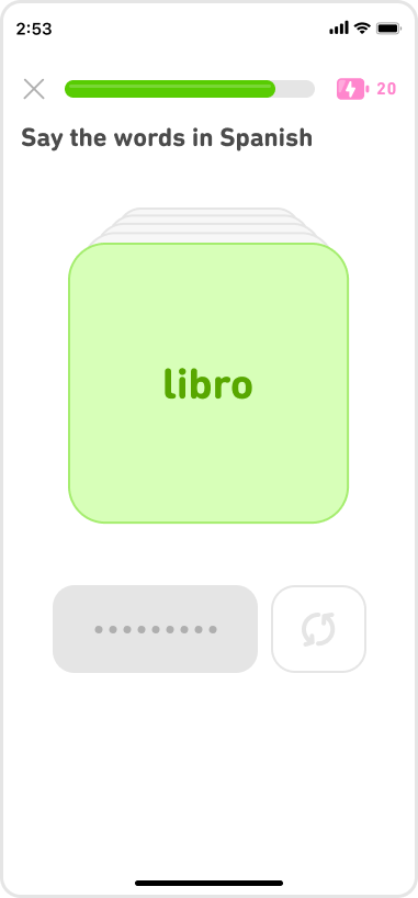 Mid-lesson screenshot with the prompt “Say the words in Spanish.” A green flashcard with the Spanish word “libro” indicates that the learner correctly translated the word “book.”