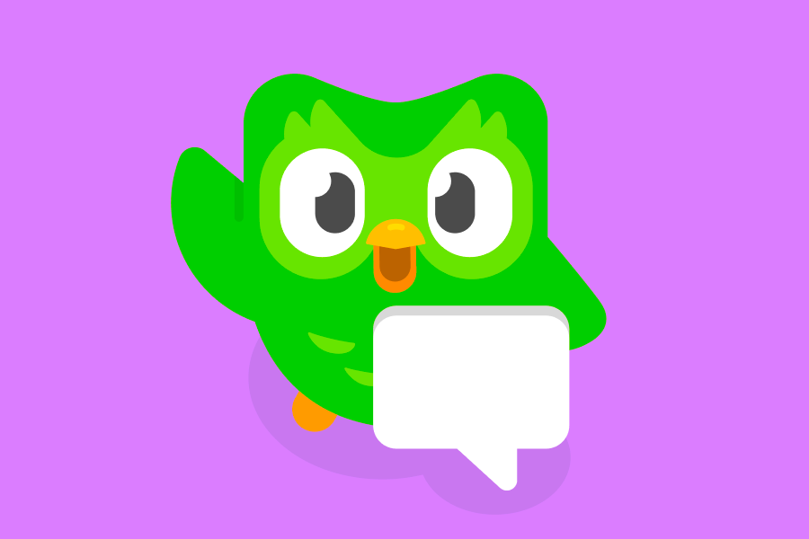 Duo the owl standing behind a speech bubble and waving at the viewer