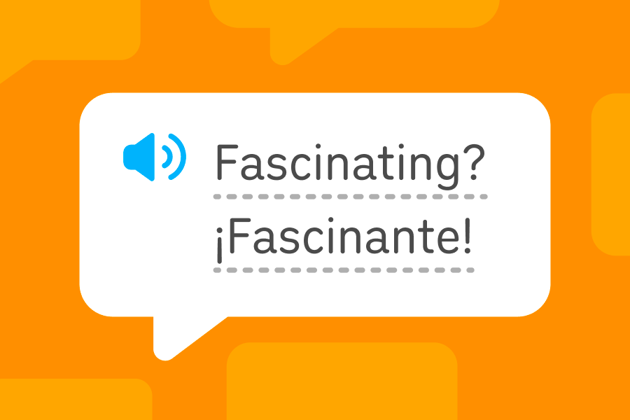 Speech bubble with the English word “fascinating” on the first row and the Spanish word “fascinante” on the second.