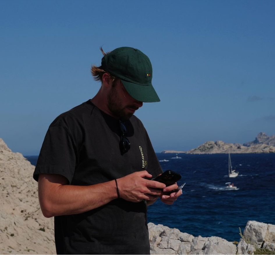 Man wearing an XTNS branded T-shirt