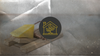 A baited mousetrap holding a wedge of cheese, picturing offense as bait in a trap