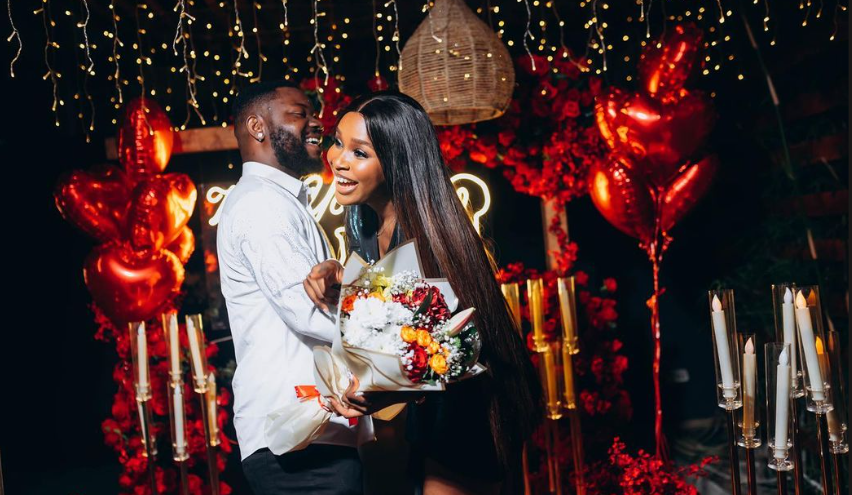 A man had just successfully proposed to the woman and was embracing her.