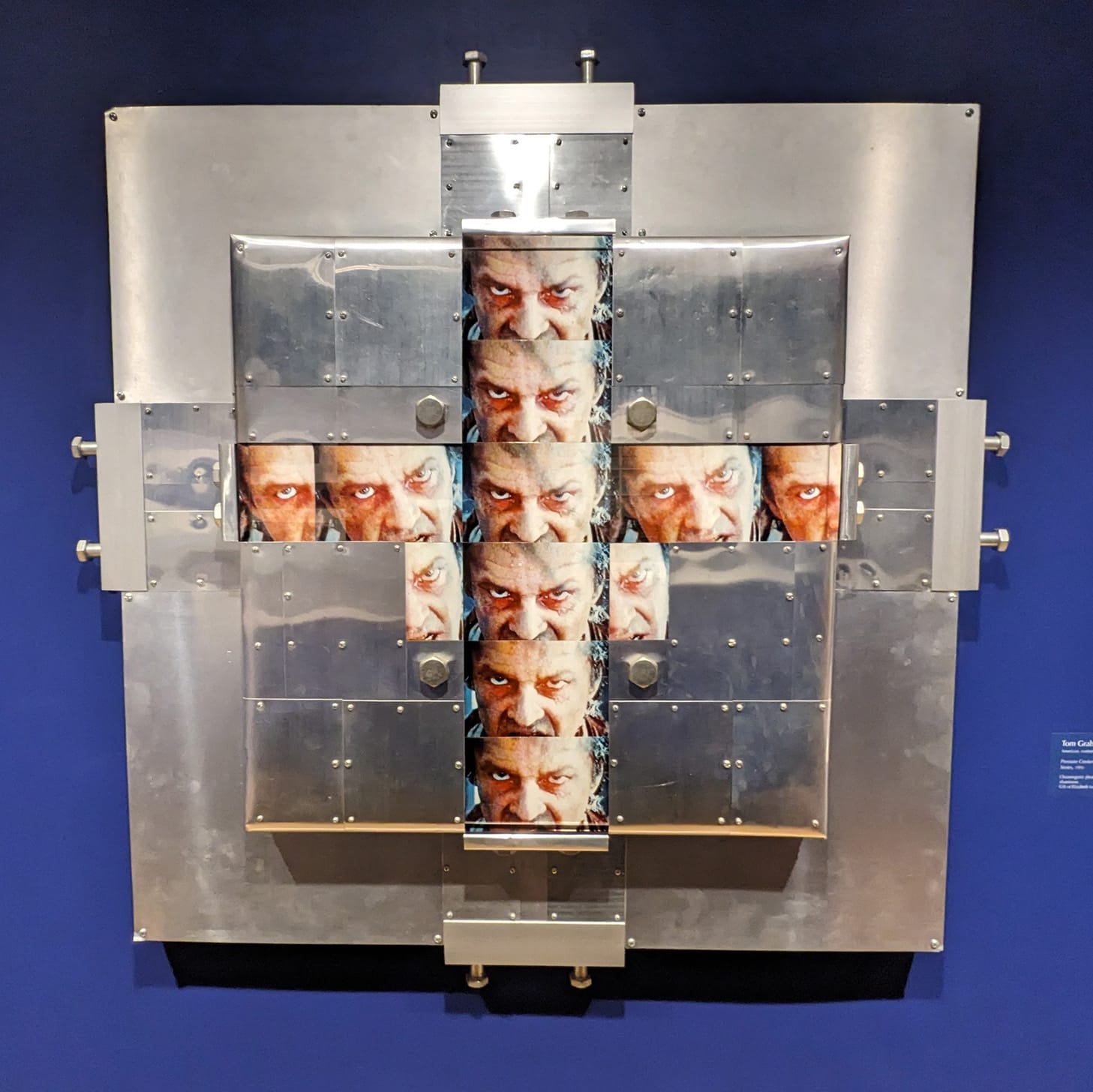 An art piece I saw at the Danforth Art Museum on a date, featuring stills of Jack Nicholson from the Shining laid over metal work. Artist unknown.