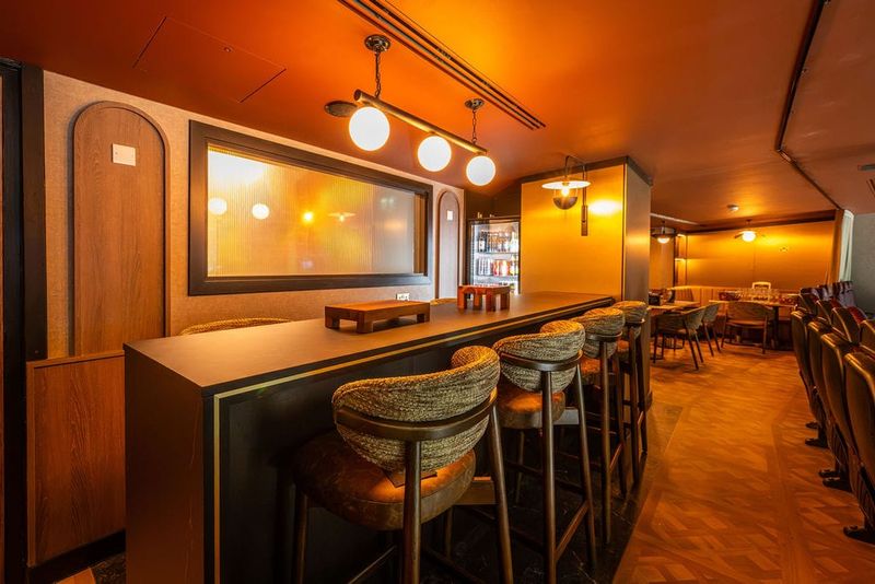 Interior of The Headliner Lounge at Motorpoint Arena Nottingham, with bar seating and arena-view chairs