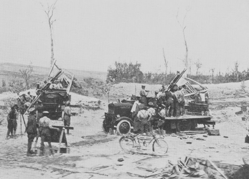 A group of men carrying guns
Description automatically generated