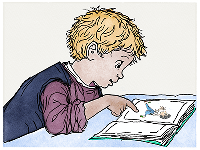 A child pointing at a picture in a book