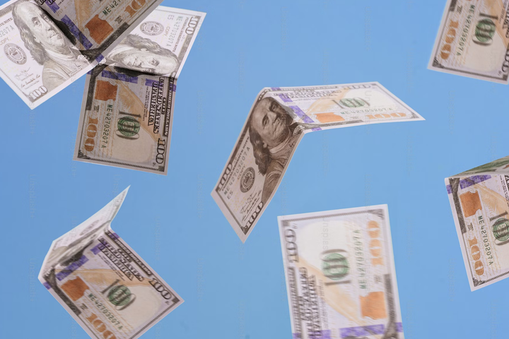 100달러 지폐 여러 장이 떨어지고 있는 모습