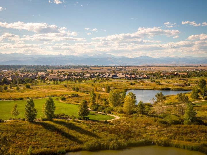 New homes in a Front Range master-planned community on the northern Colorado plains, foothills on the horizon.