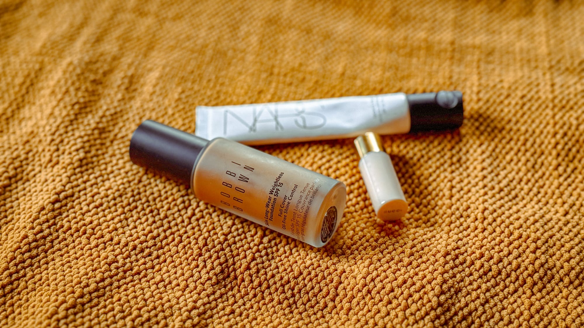 Bobbi Brown Skin Foundation SPF 15 in Golden Almond on neutral fabric