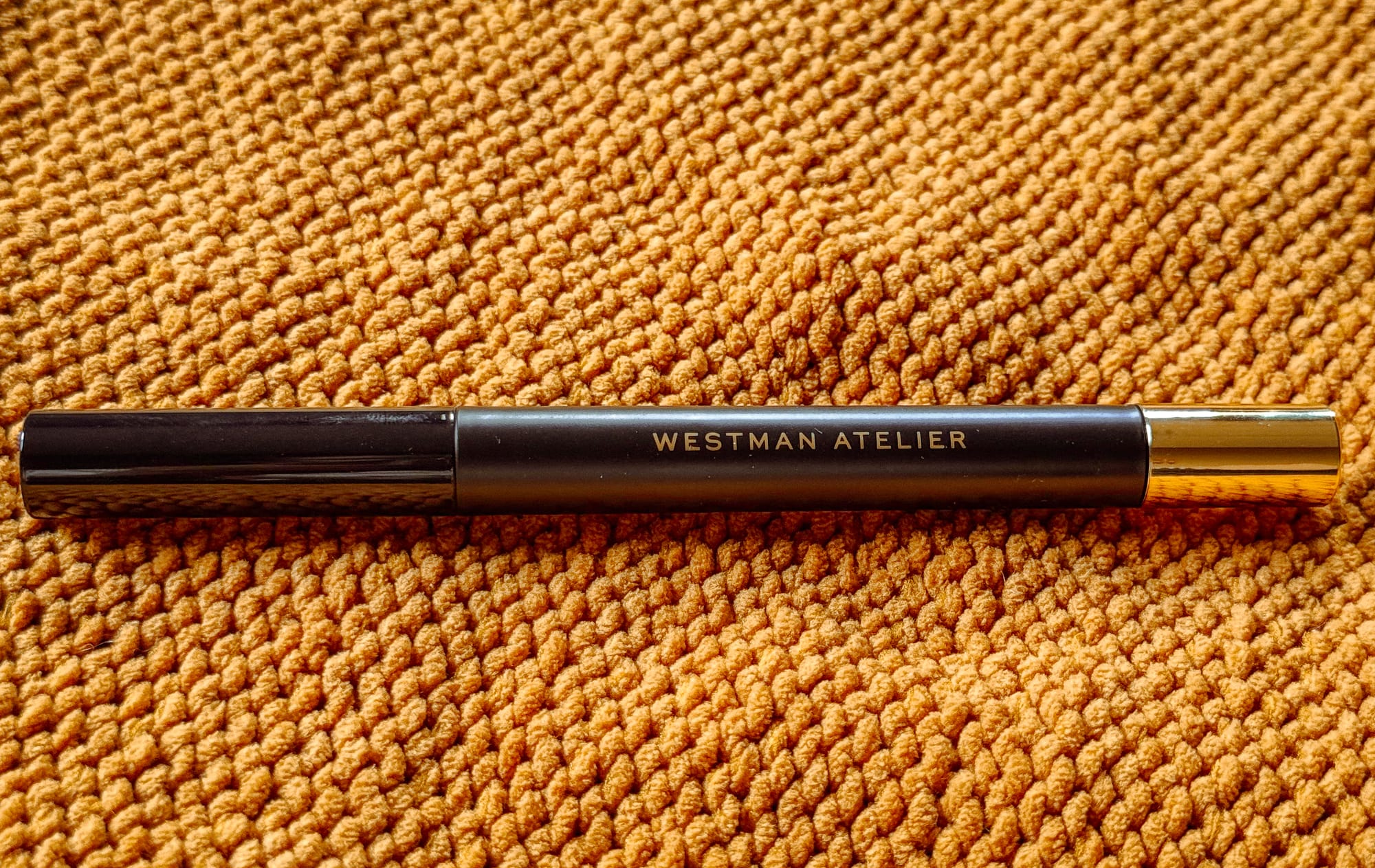 Westman Atelier Bonne Brow Defining Pencil with spoolie on neutral backdrop