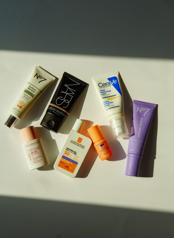 A flat lay of seven sunscreen and SPF products, including La Roche-Posay, CeraVe, Clarins, No7, Ultra Violette and NARS Tinted Moisturiser.
