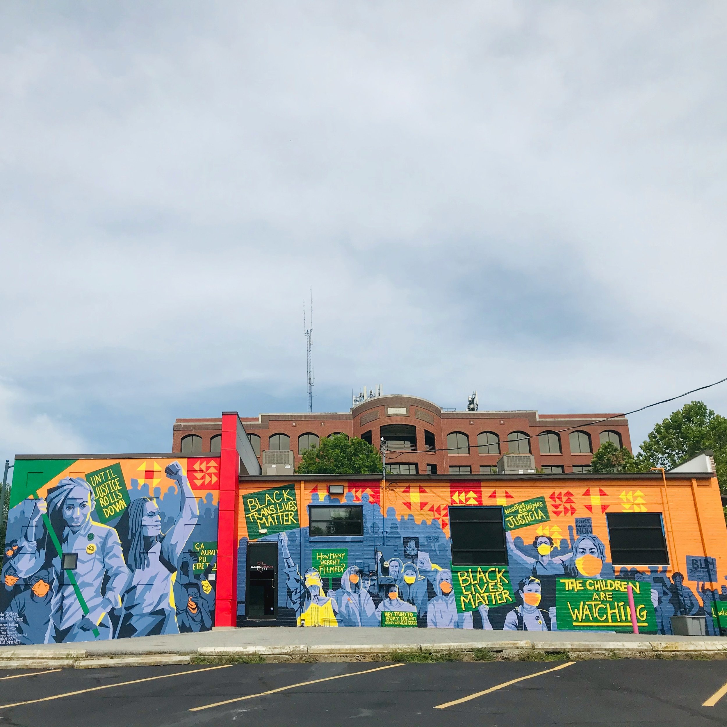   No Justice, No Peace , by artists Sharon Killian, Morgan Bame, Octavio Logo, Jody Travis Thompson, Hannah Newsome Doyle, and Joëlle Storet   Read Fayetteville Flyer Articles re: Mural Project  | Photo by  Ashley Lane  on  Unsplash  
