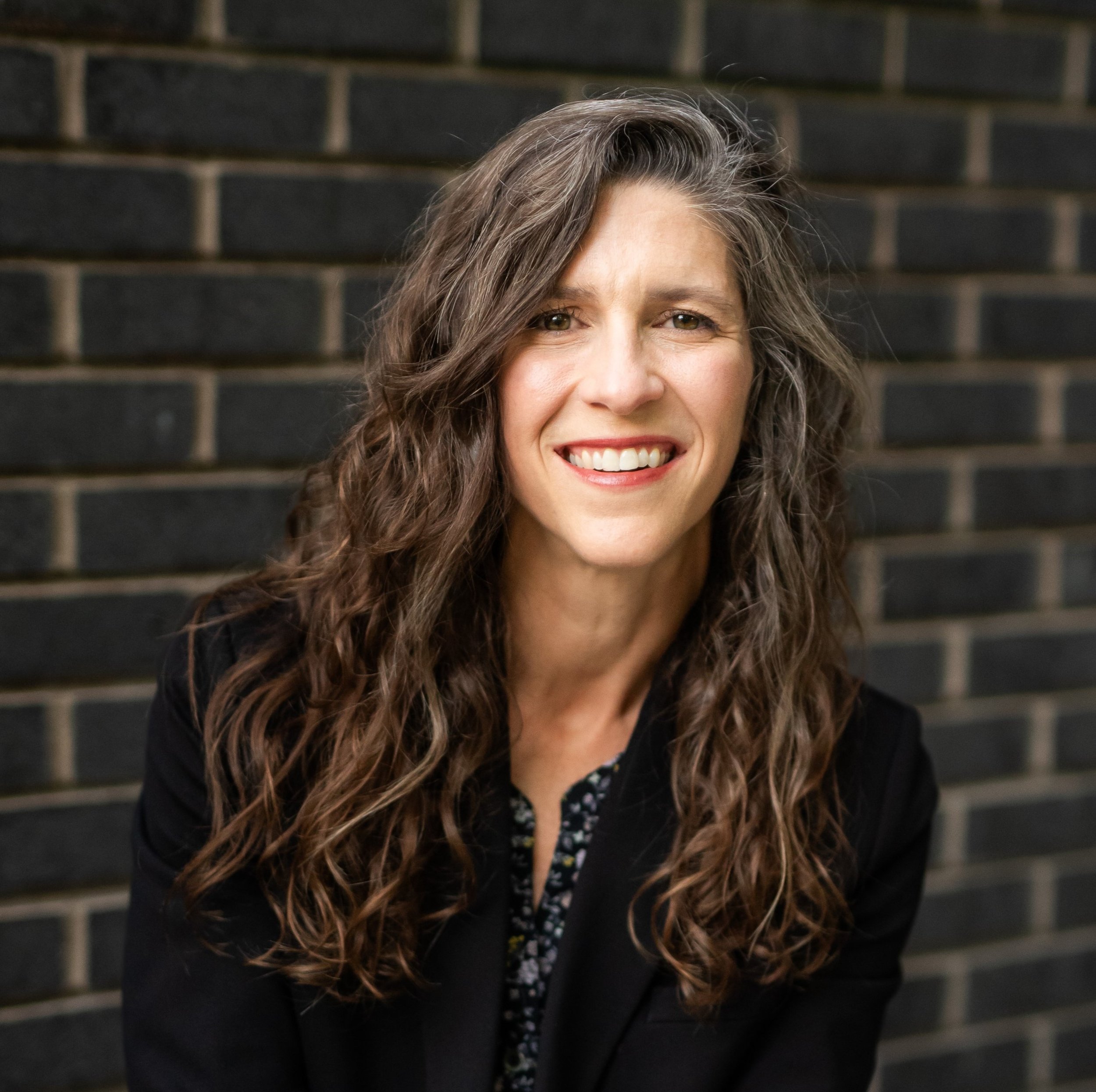   Ginny Mooney, Co-Founder & Executive Director of 99 Balloons.  