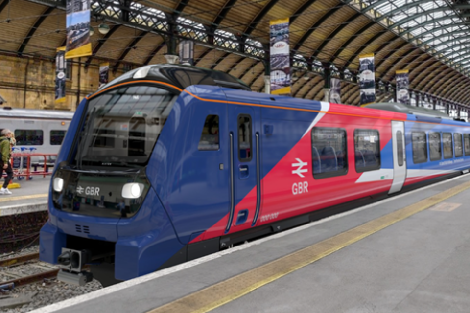 Commuters waiting on a busy platform at a northern English station