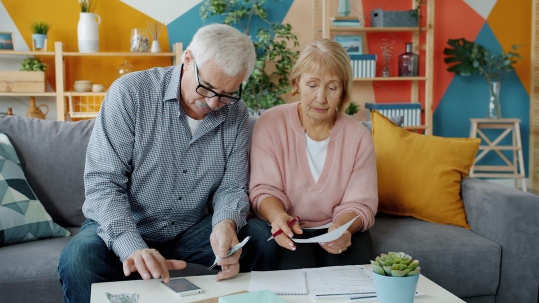Couple reviewing pension and estate planning documents