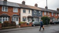 A row of British terraced houses on a suburban street