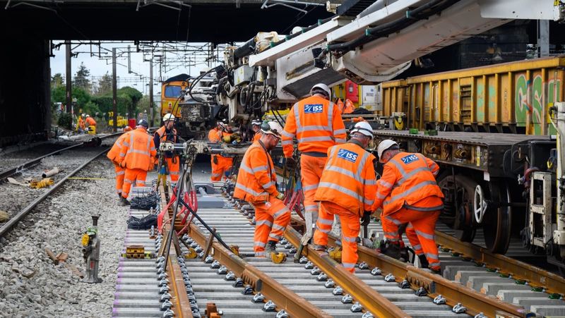 Track workers installing new rails at Willesden Junction on the West Coast Main Line