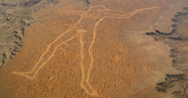 Who Drew the Giant Naked Guy in the Desert? (And Why Do We Love Him?)