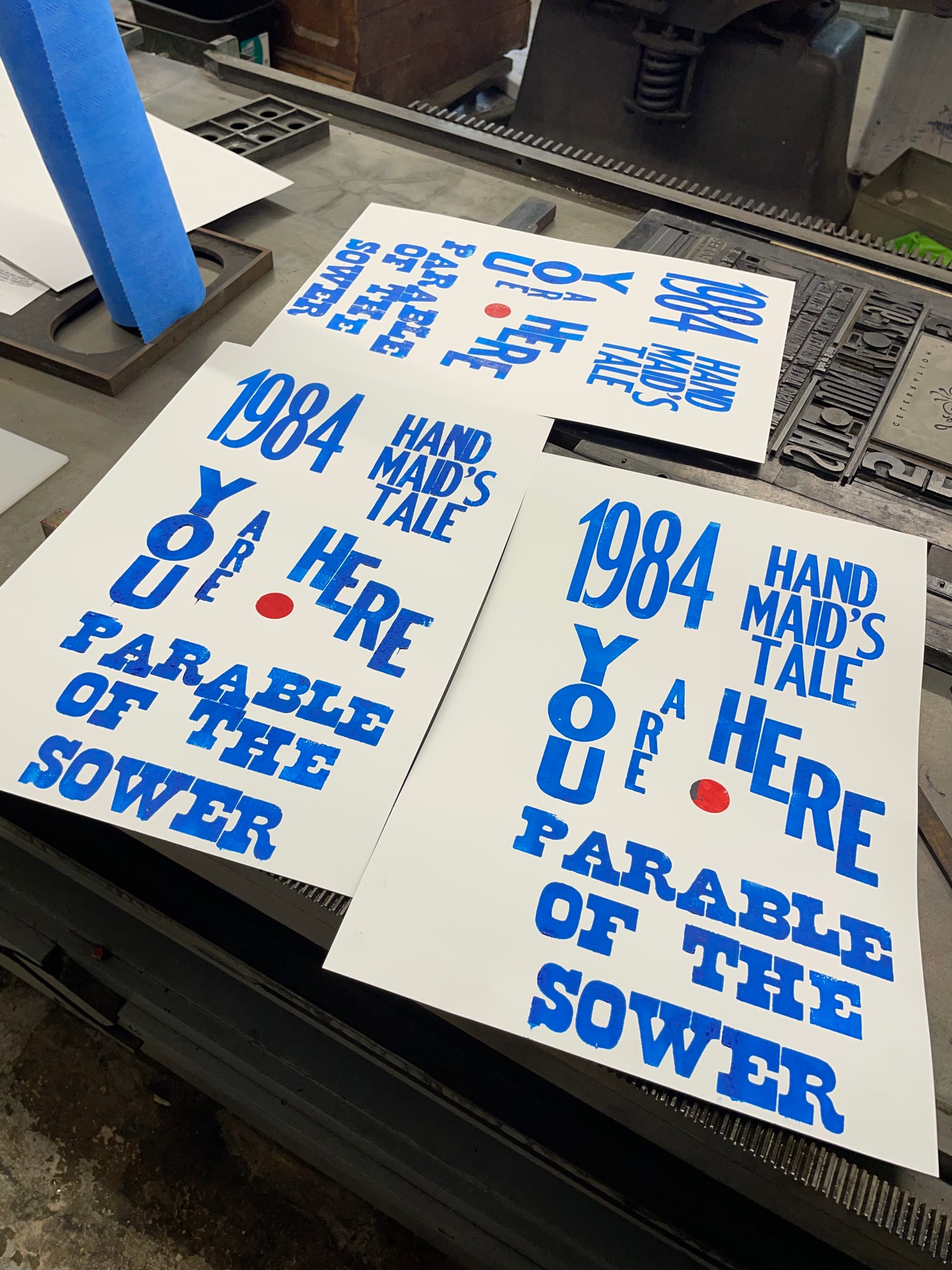 three letterpress printed posters