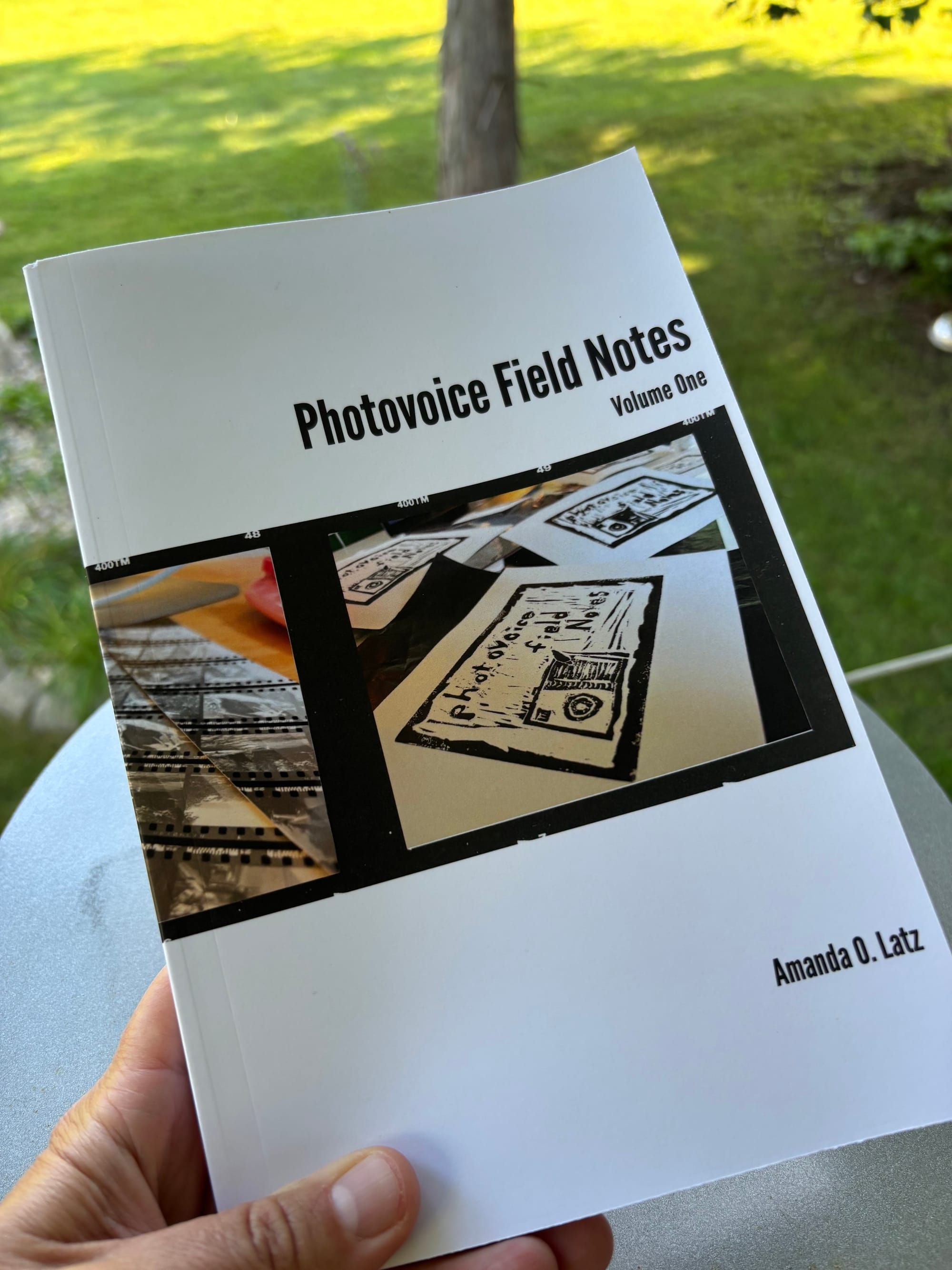 front cover of the book Photovoice Field Notes: Volume One by Amanda O. Latz against a natural background
