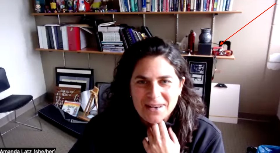 image of the author in her on-campus office, meant to highlight the View-Master on a shelf in the background