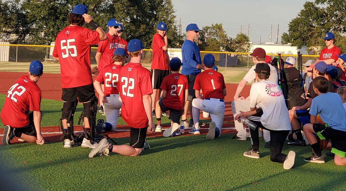 Coaches address players before a Tomball Kings baseball tryout.