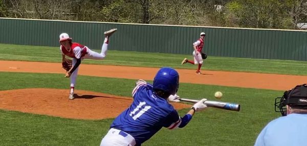 Tomball Kings baseball player bunts for a base hit.