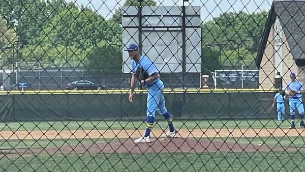 Clayton Holt stands on the pitcher's mound, preparing to pitch for the LeTourneau YellowJackets.