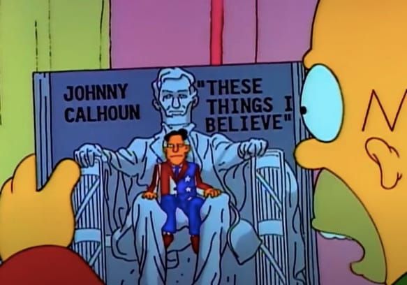 Homer Simpson looking at a spoken-word political album.