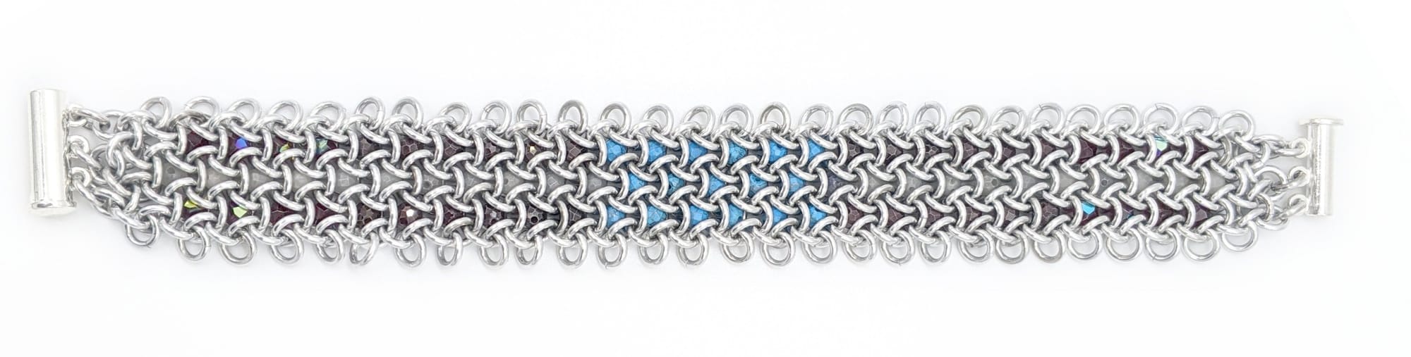 A wide bracelet made of 3 rows of interlocking hexagons, with gemstone beads captured inside each one.