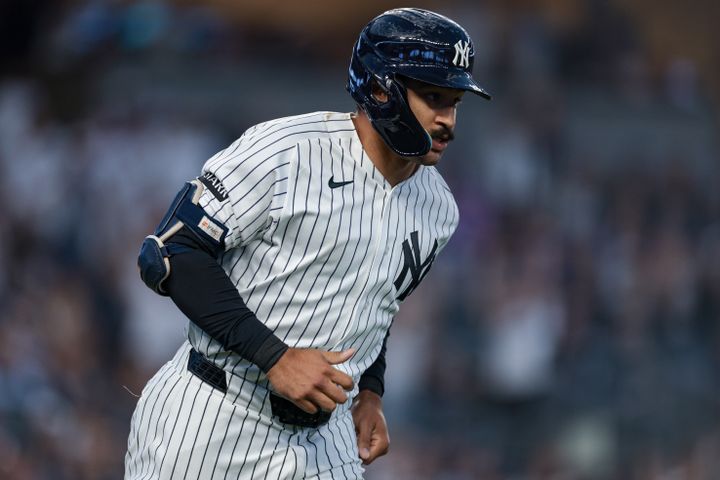 Yankees center fielder Trent Grisham (12) rounds the bases after hitting a solo home run during the fifth inning against the