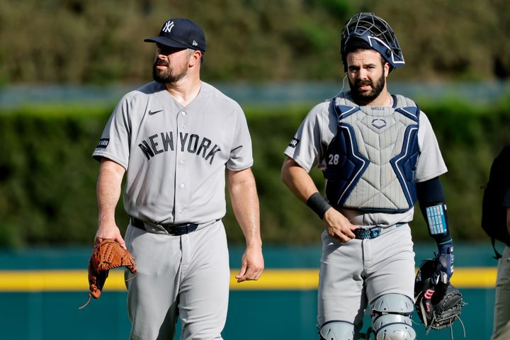 Yankees pitcher Carlos Rodon (55) and catcher Austin Wells walk in from the bull pen before the game against the Detroit Tige